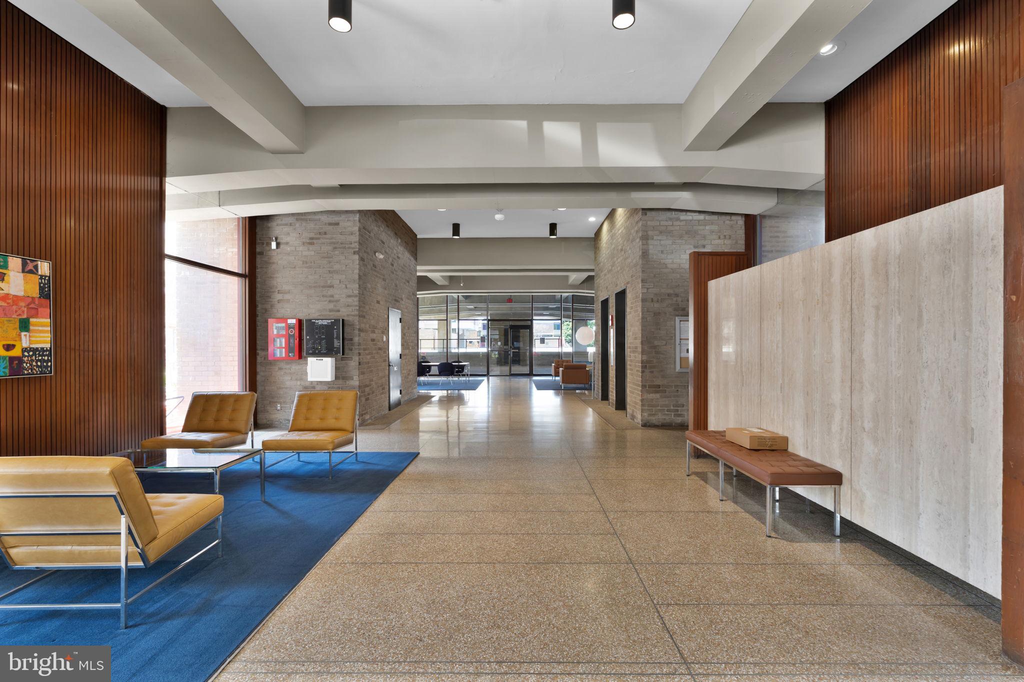 1245 4th Street Southwest, Unit E210 Washington, DC 20024 - Photo 3 of 28 a lobby with furniture and rug