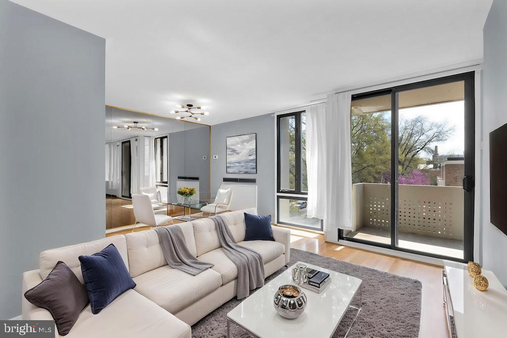 1245 4th Street Southwest, Unit E210 Washington, DC 20024 - Photo 4 of 28 a living room with furniture and a large window