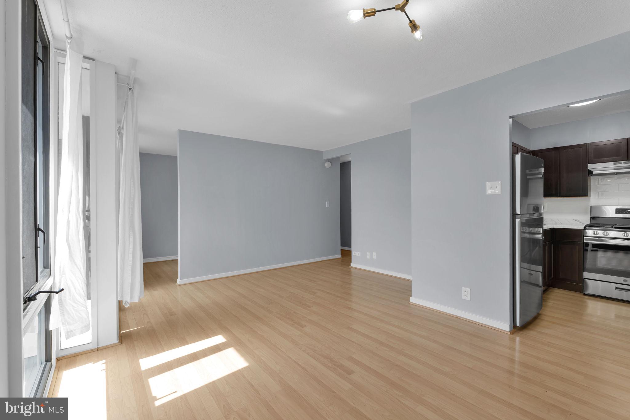 1245 4th Street Southwest, Unit E210 Washington, DC 20024 - Photo 7 of 28 a view of livingroom with hardwood floor and a window