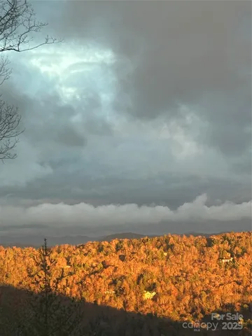 a lobby with furniture and floor to ceiling window