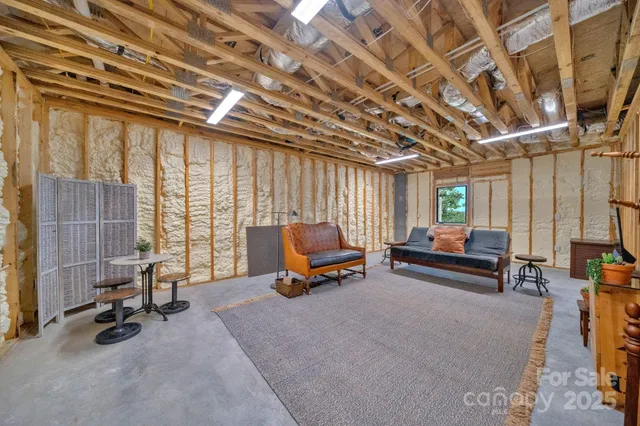 a living room with furniture gym equipment and a view of living room