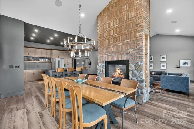 a kitchen with stainless steel appliances kitchen island granite countertop a stove a sink and a refrigerator