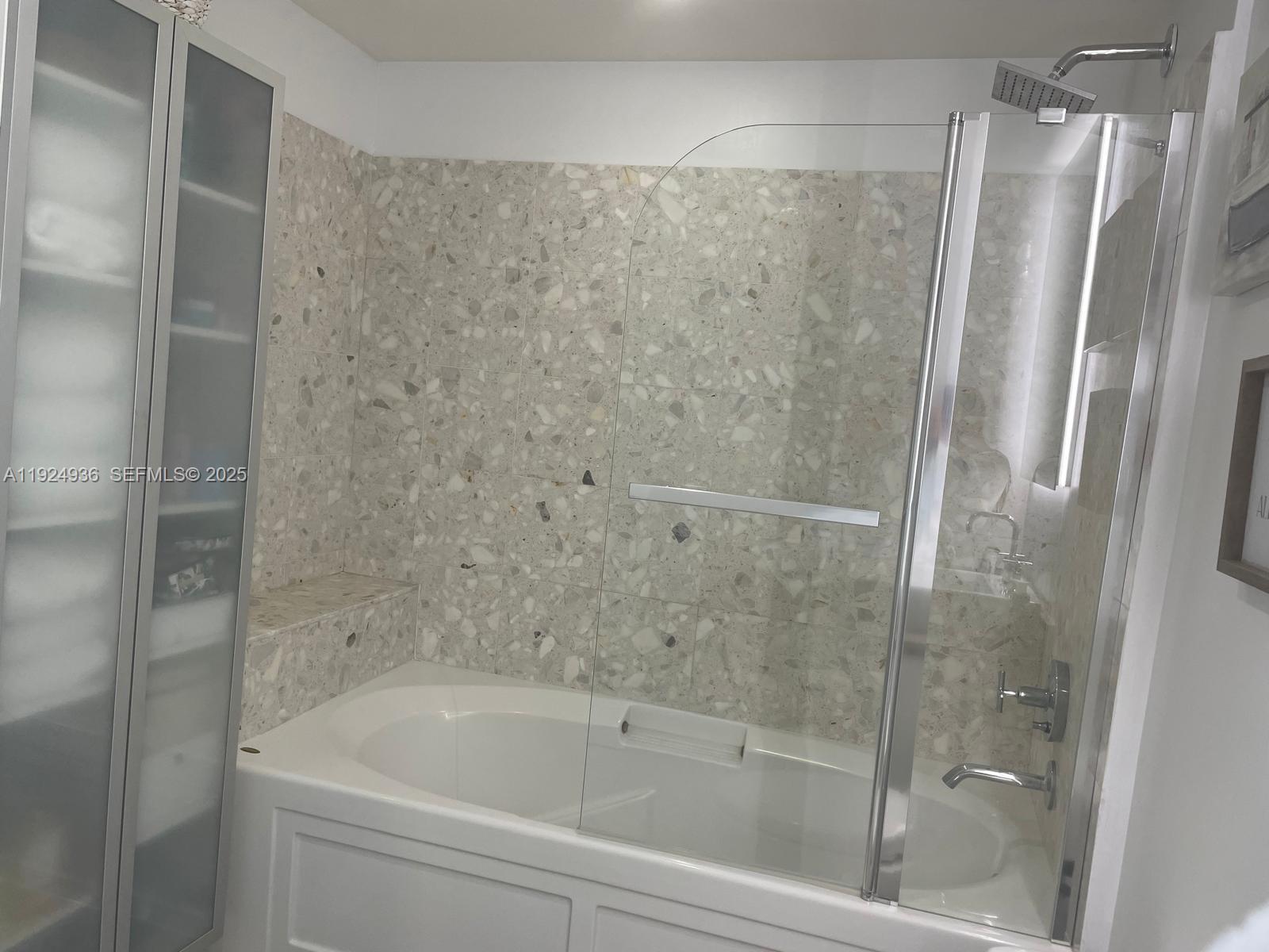 185 Southwest 7th Street, Unit 2014 Miami, FL 33130 - Photo 17 of 38 a bathroom with a bathtub and a shower