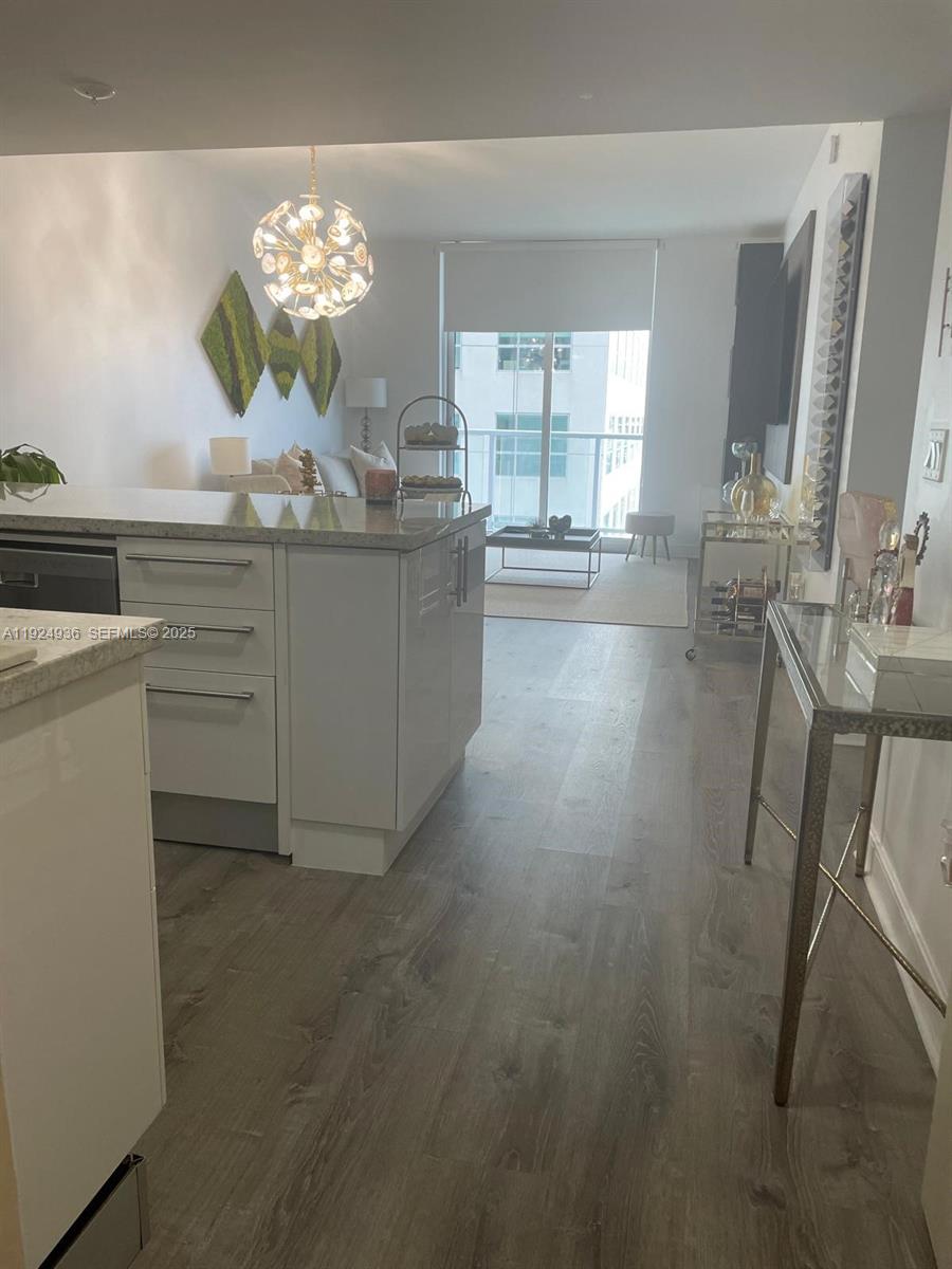 185 Southwest 7th Street, Unit 2014 Miami, FL 33130 - Photo 22 of 38 a view of living room with furniture and chandelier