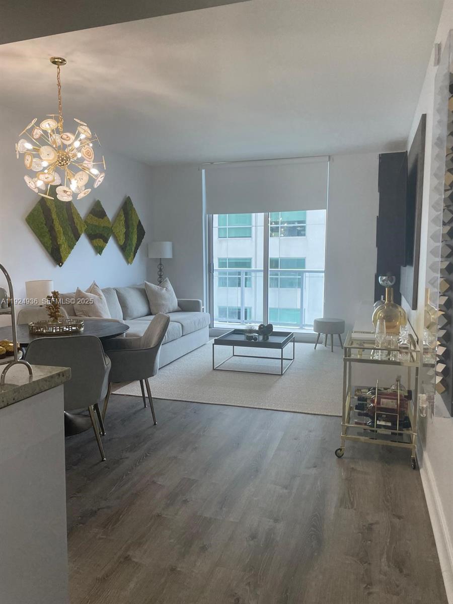 185 Southwest 7th Street, Unit 2014 Miami, FL 33130 - Photo 26 of 38 a living room with furniture and a large window