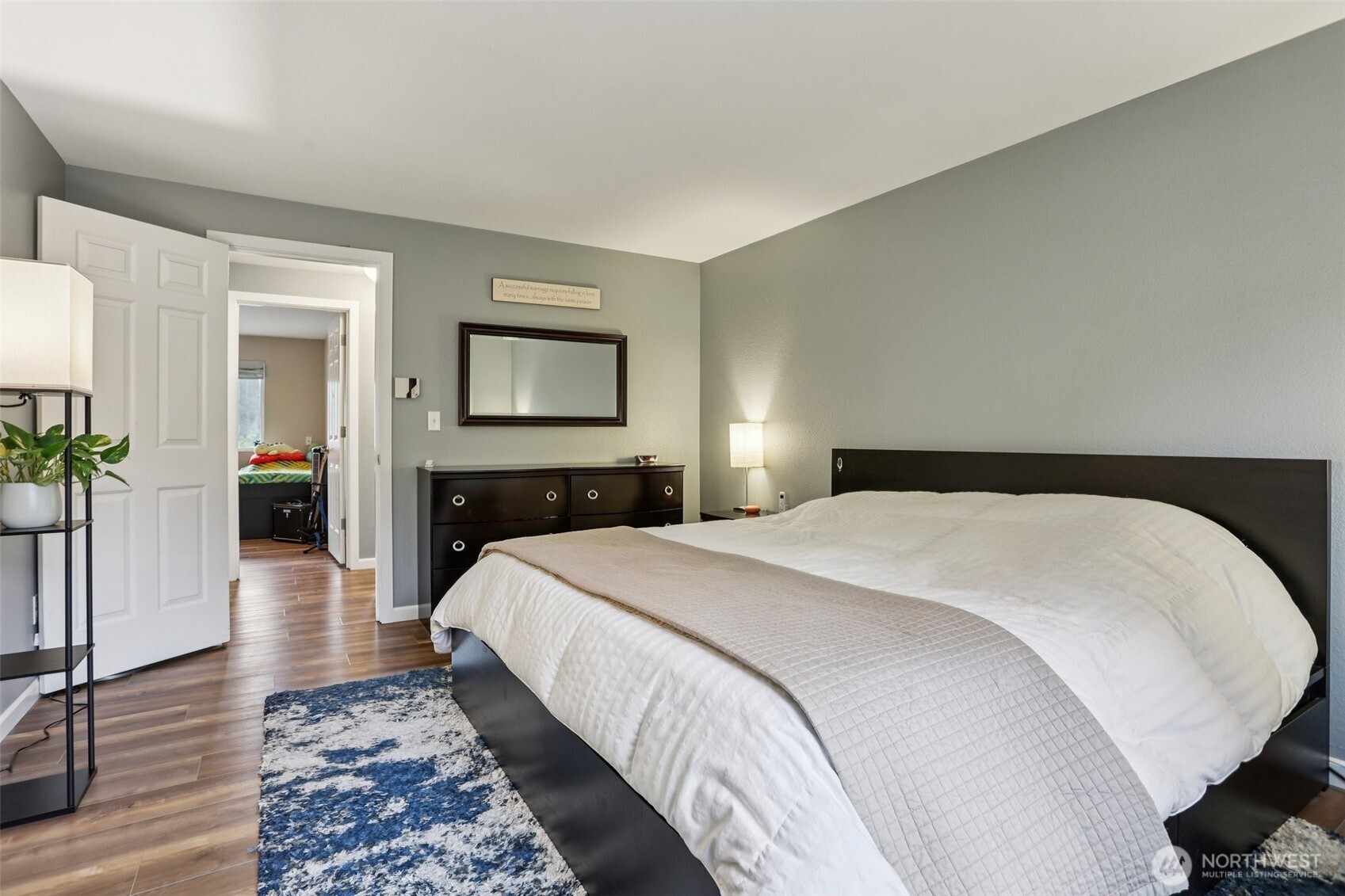 2611 178th Street Southeast Bothell, WA 98012 - Photo 15 of 27 a bedroom with a bed and wooden floor