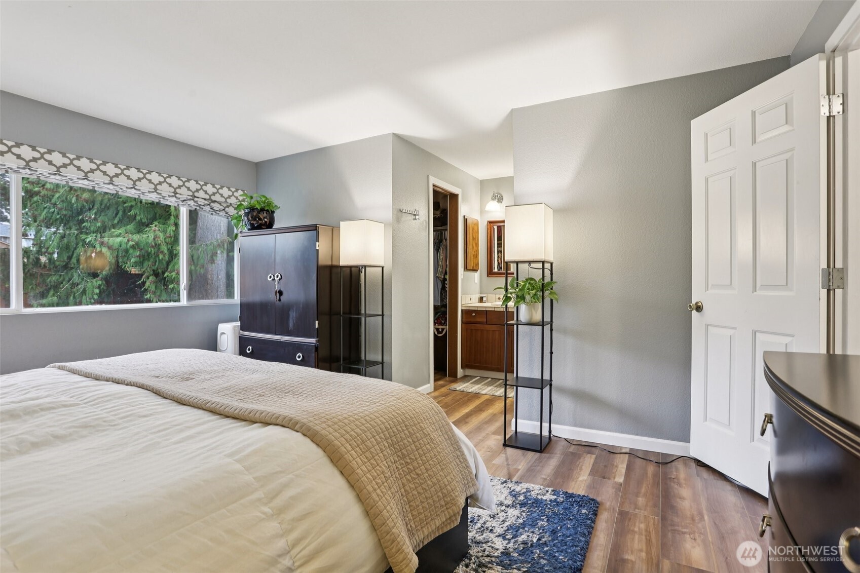2611 178th Street Southeast Bothell, WA 98012 - Photo 16 of 27 a bedroom with a bed dresser and a large window