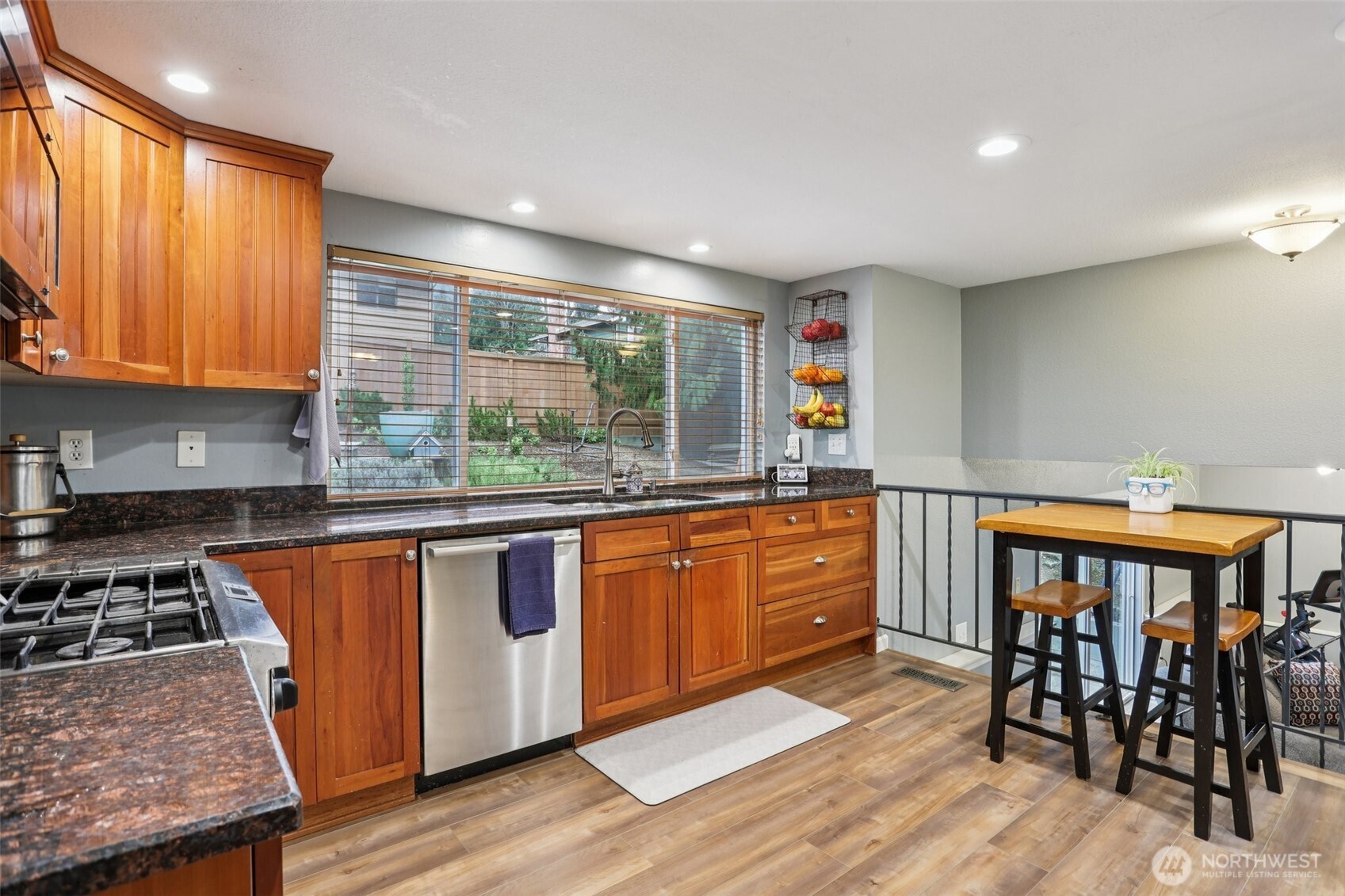 2611 178th Street Southeast Bothell, WA 98012 - Photo 7 of 27 a kitchen with stainless steel appliances granite countertop sink stove top oven and cabinets