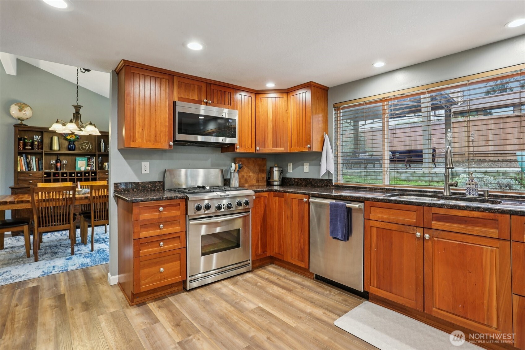 2611 178th Street Southeast Bothell, WA 98012 - Photo 8 of 27 a kitchen with stainless steel appliances granite countertop a stove sink and cabinets