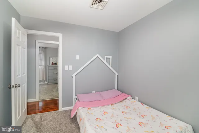 a bedroom with a bed and a shower