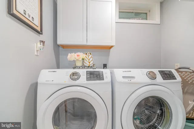 a utility room with dryer and washer