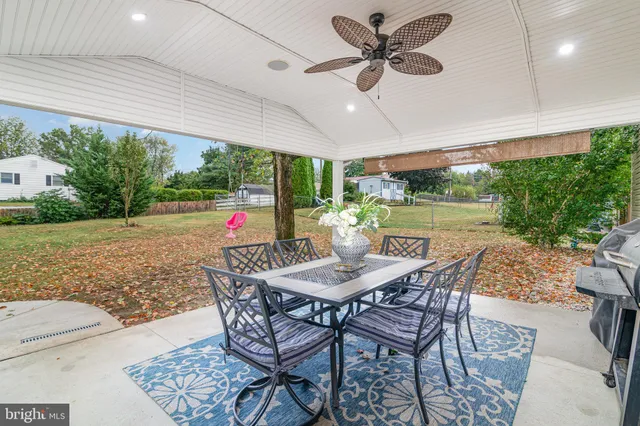 a dining room with furniture and a yard