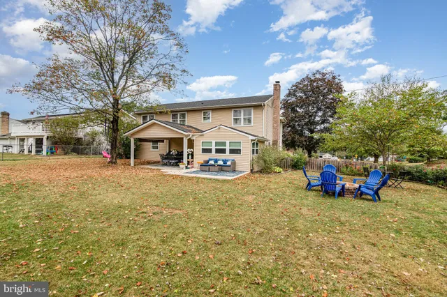 a view of a house with outdoor space and sitting area