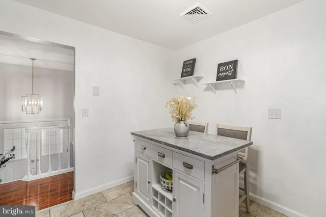 a view of kitchen island with cabinets