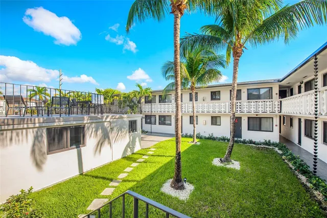 a front view of a building with sign board