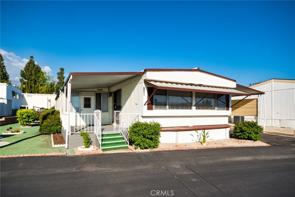12220 5th Street Yucaipa, CA 92399 - Photo 1 of 1 a front view of a house with a yard