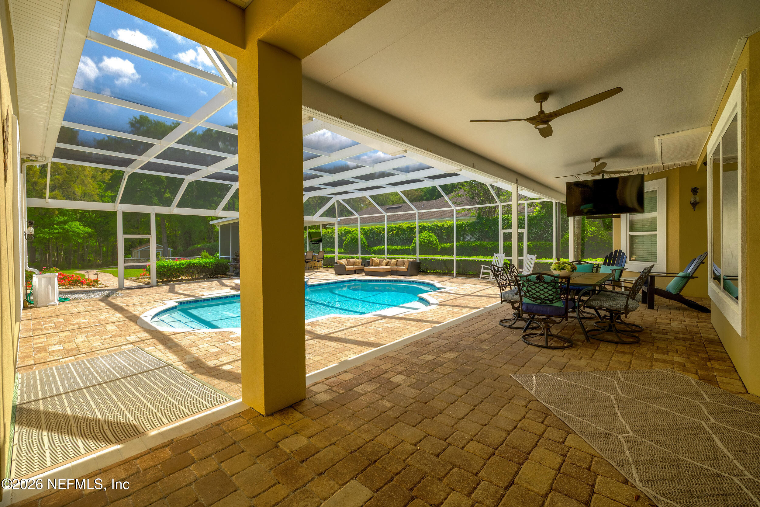 3225 Bishop Estates Road St. Johns, FL 32259 - Photo 70 of 90 a view of a porch with chairs and floor to ceiling window