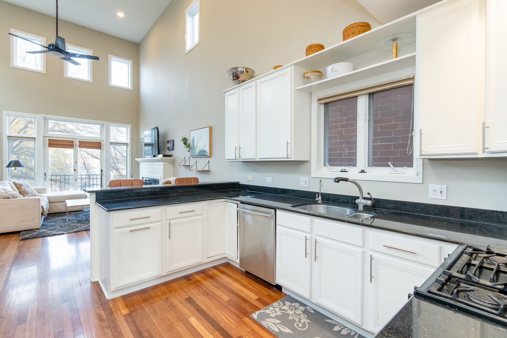 1409 West Huron Street, Unit 3 Chicago, IL 60642 - Photo 15 of 42 a kitchen with granite countertop a sink a stove and cabinets