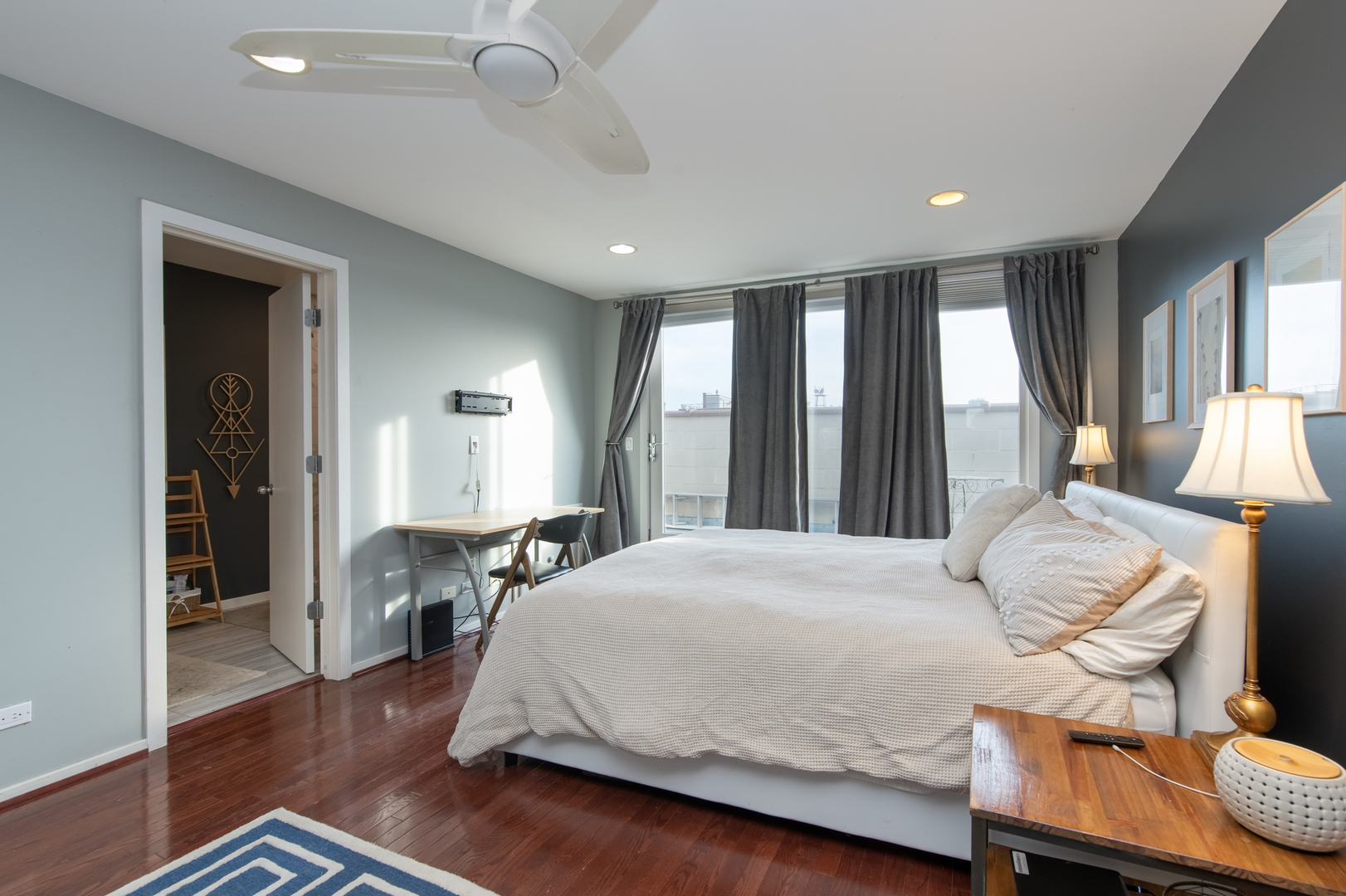 1409 West Huron Street, Unit 3 Chicago, IL 60642 - Photo 18 of 42 a bedroom with a bed and wooden floor