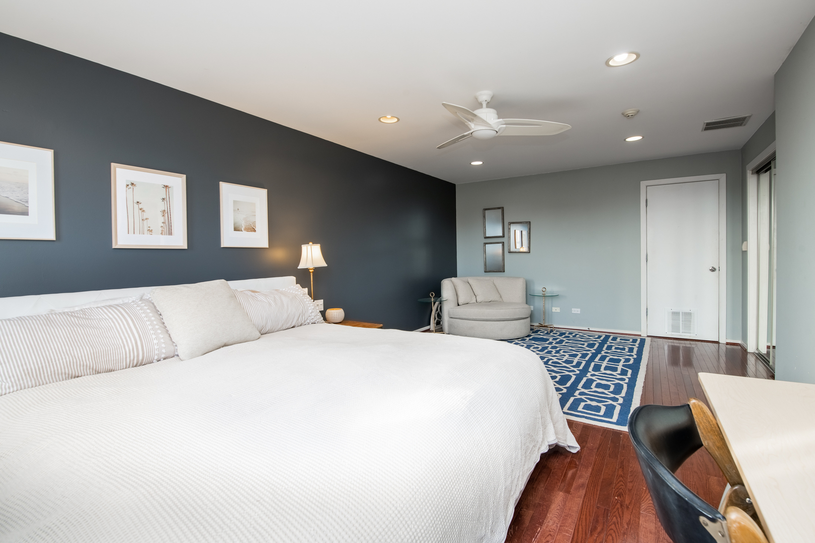 1409 West Huron Street, Unit 3 Chicago, IL 60642 - Photo 19 of 42 a bedroom with a large bed and a chandelier