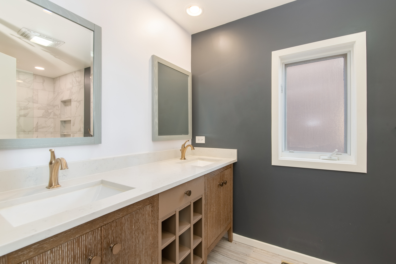1409 West Huron Street, Unit 3 Chicago, IL 60642 - Photo 20 of 42 a bathroom with a sink and a mirror