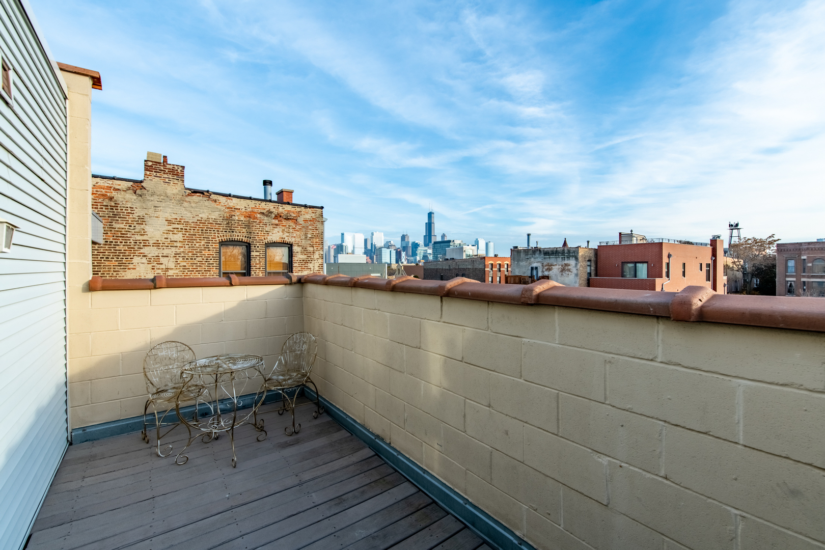 1409 West Huron Street, Unit 3 Chicago, IL 60642 - Photo 24 of 42 a terrace with outdoor seating and city view
