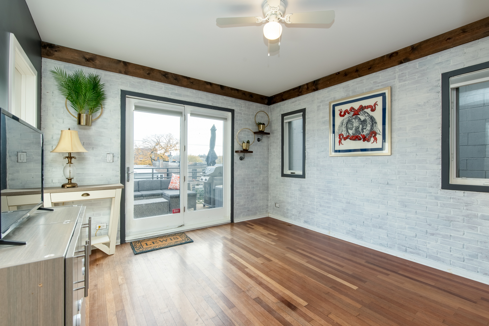 1409 West Huron Street, Unit 3 Chicago, IL 60642 - Photo 27 of 42 a view of empty room with wooden floor and fan