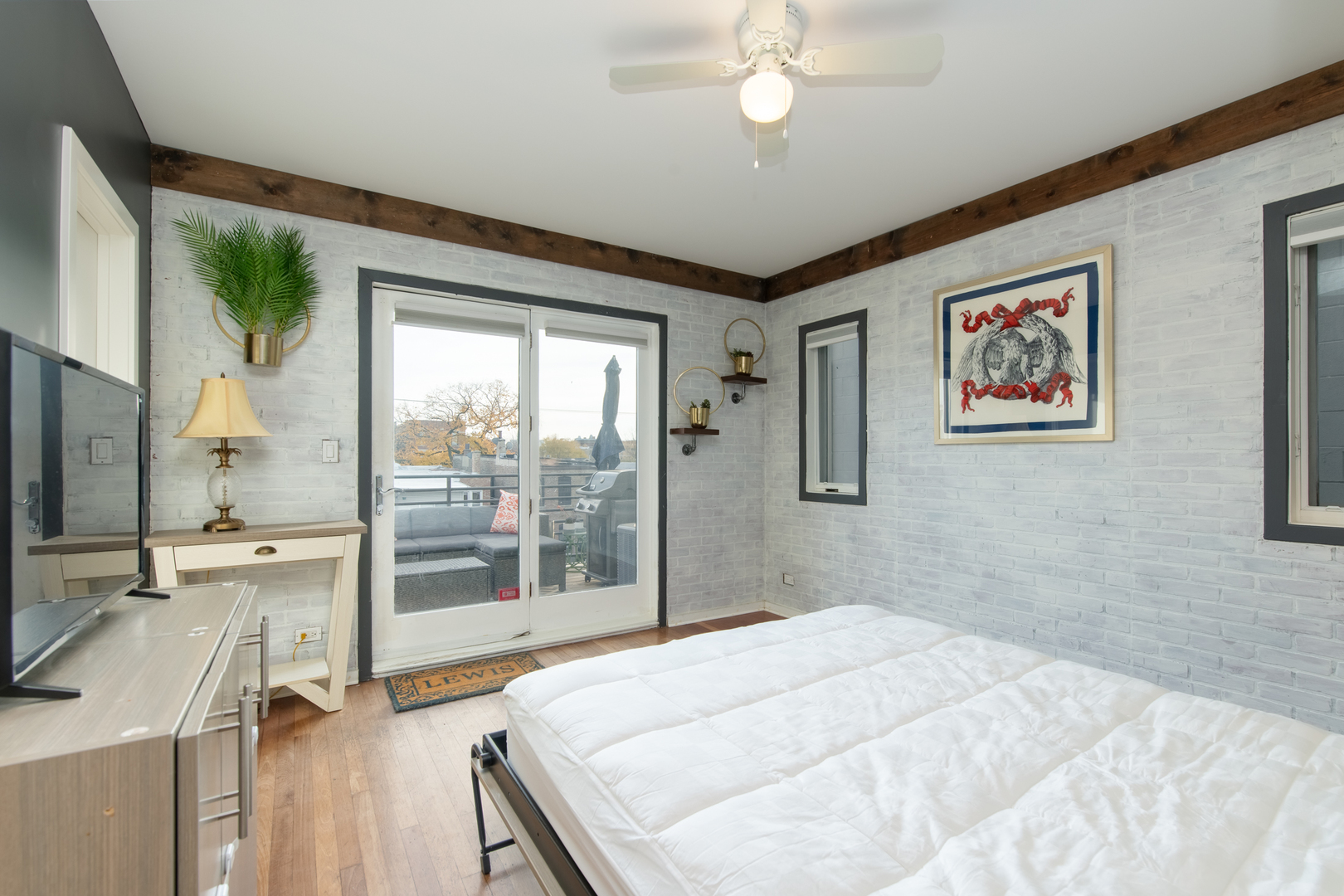1409 West Huron Street, Unit 3 Chicago, IL 60642 - Photo 29 of 42 a bedroom with a large bed and a large window