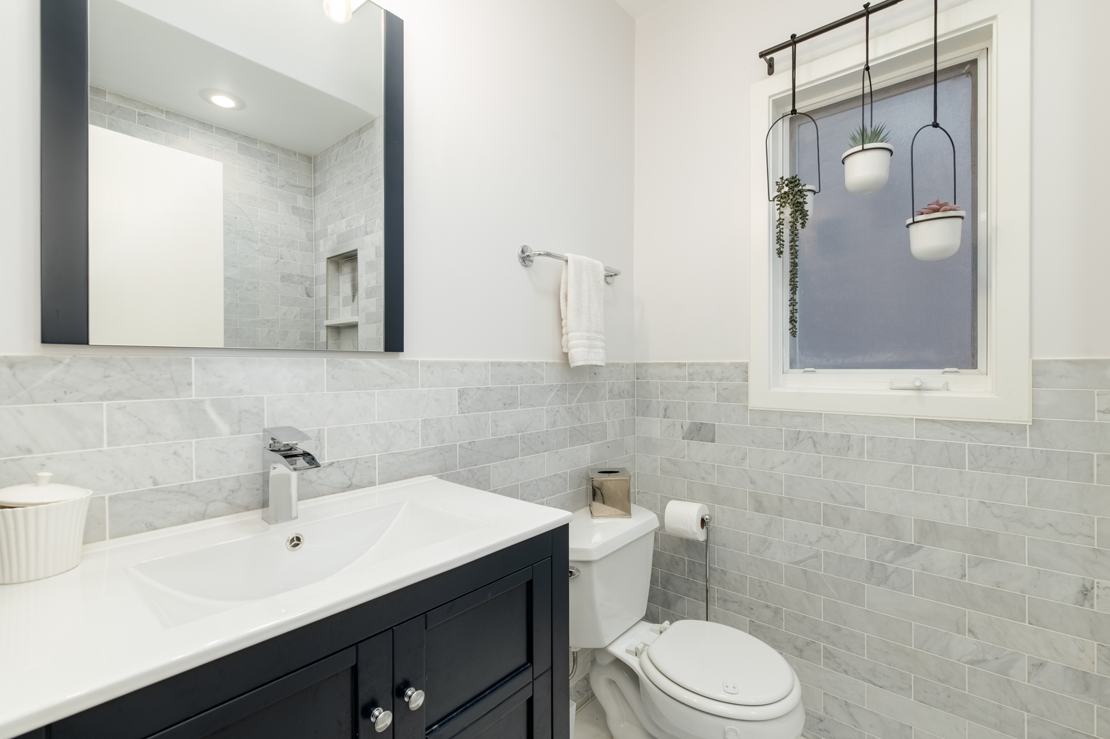 1409 West Huron Street, Unit 3 Chicago, IL 60642 - Photo 30 of 42 a bathroom with a sink a toilet and mirror