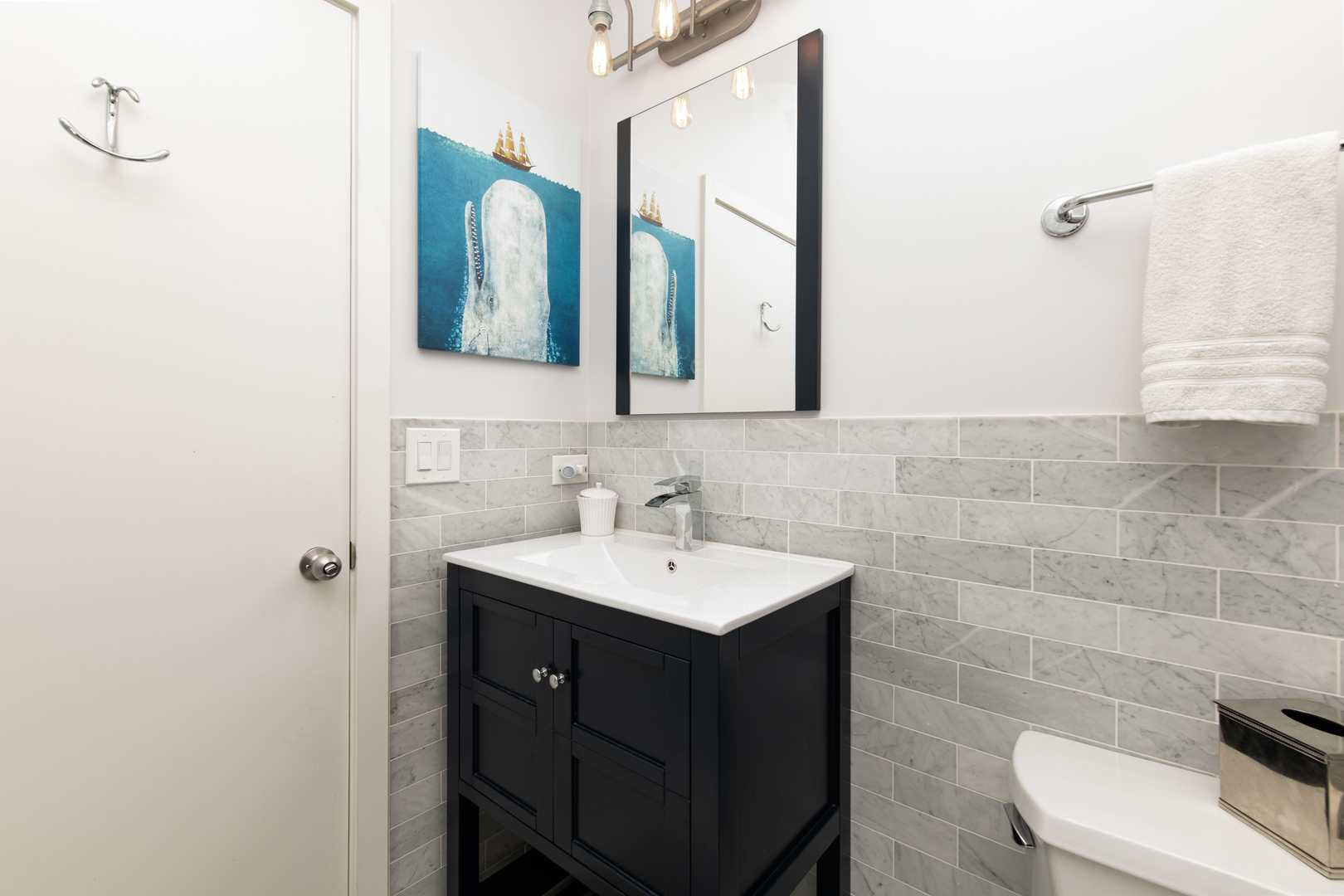1409 West Huron Street, Unit 3 Chicago, IL 60642 - Photo 32 of 42 a bathroom with a sink and a mirror