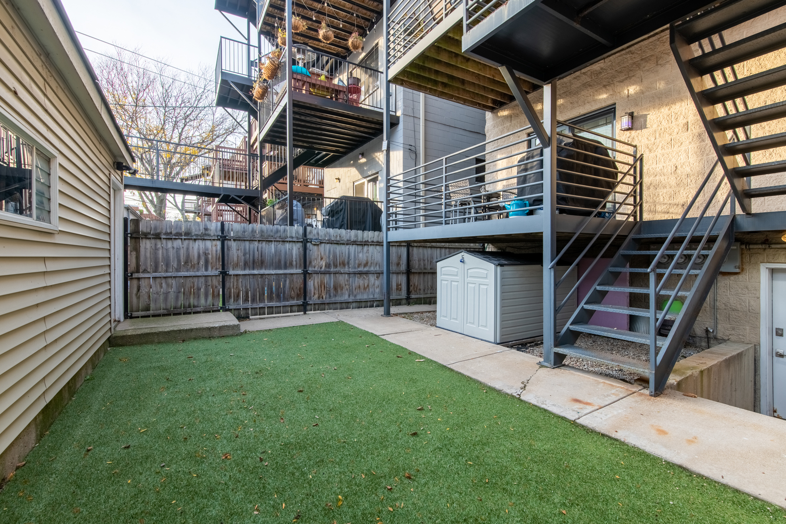 1409 West Huron Street, Unit 3 Chicago, IL 60642 - Photo 41 of 42 a view of a backyard with stairs