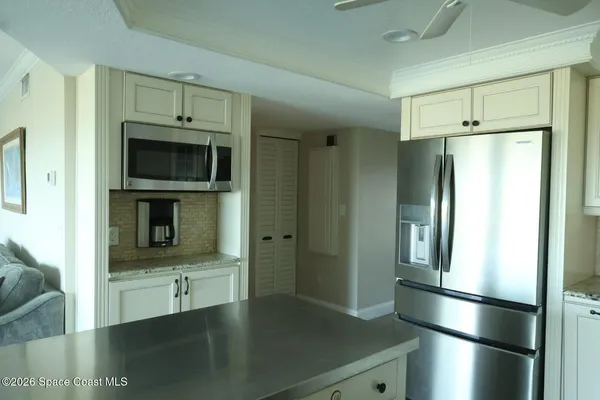 a bathroom with a double vanity sink and a large mirror