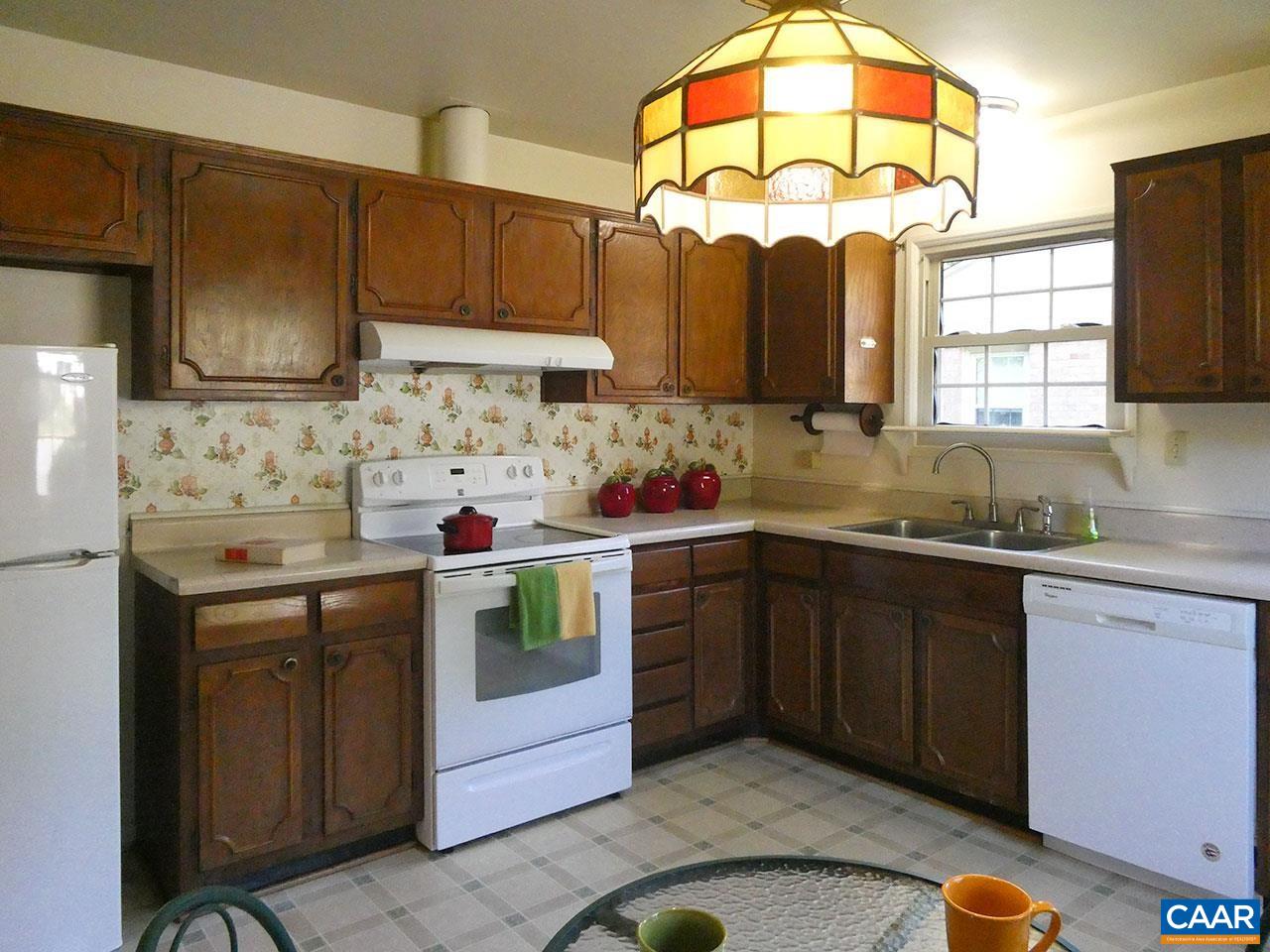 106 Elkhorn Road Charlottesville, VA 22903 - Photo 11 of 27 a kitchen with a sink cabinets and window