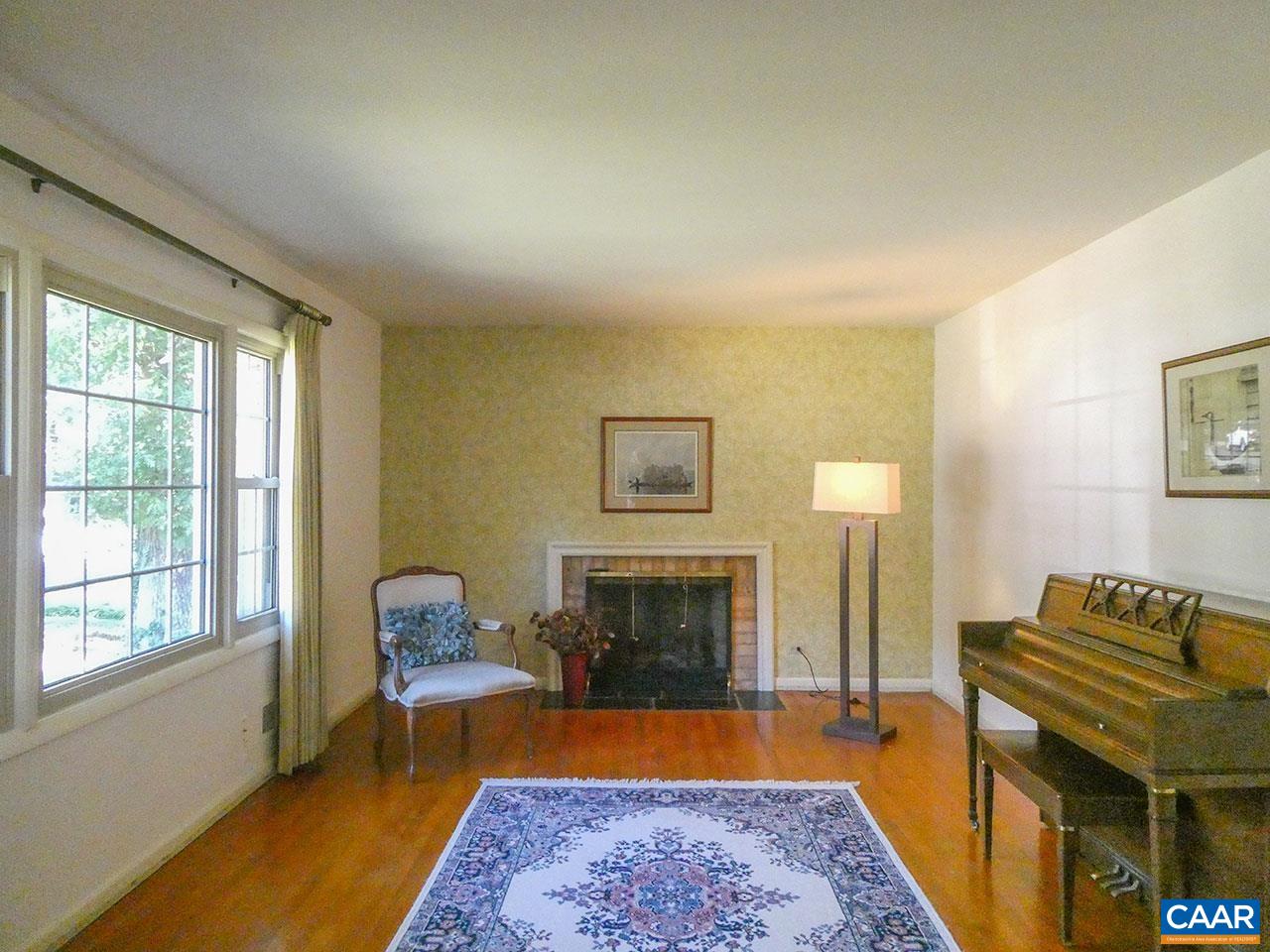106 Elkhorn Road Charlottesville, VA 22903 - Photo 3 of 27 a bedroom with furniture and a fireplace
