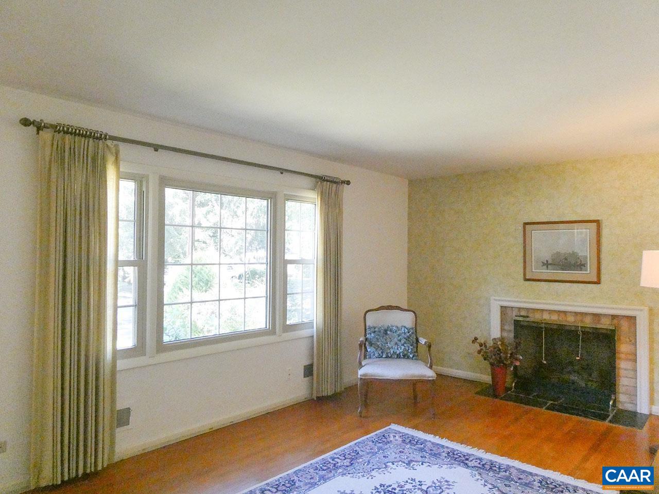 106 Elkhorn Road Charlottesville, VA 22903 - Photo 4 of 27 a bedroom with a bed and a fireplace