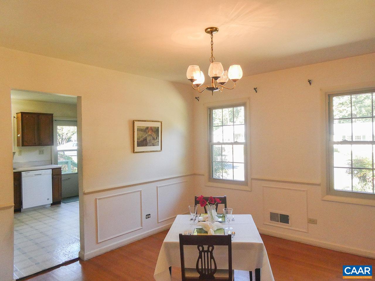 106 Elkhorn Road Charlottesville, VA 22903 - Photo 7 of 27 a view of a dining room with furniture window and wooden floor