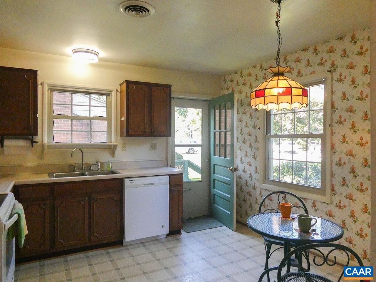 106 Elkhorn Road Charlottesville, VA 22903 - Photo 9 of 27 a kitchen that has a sink a window and a table in it