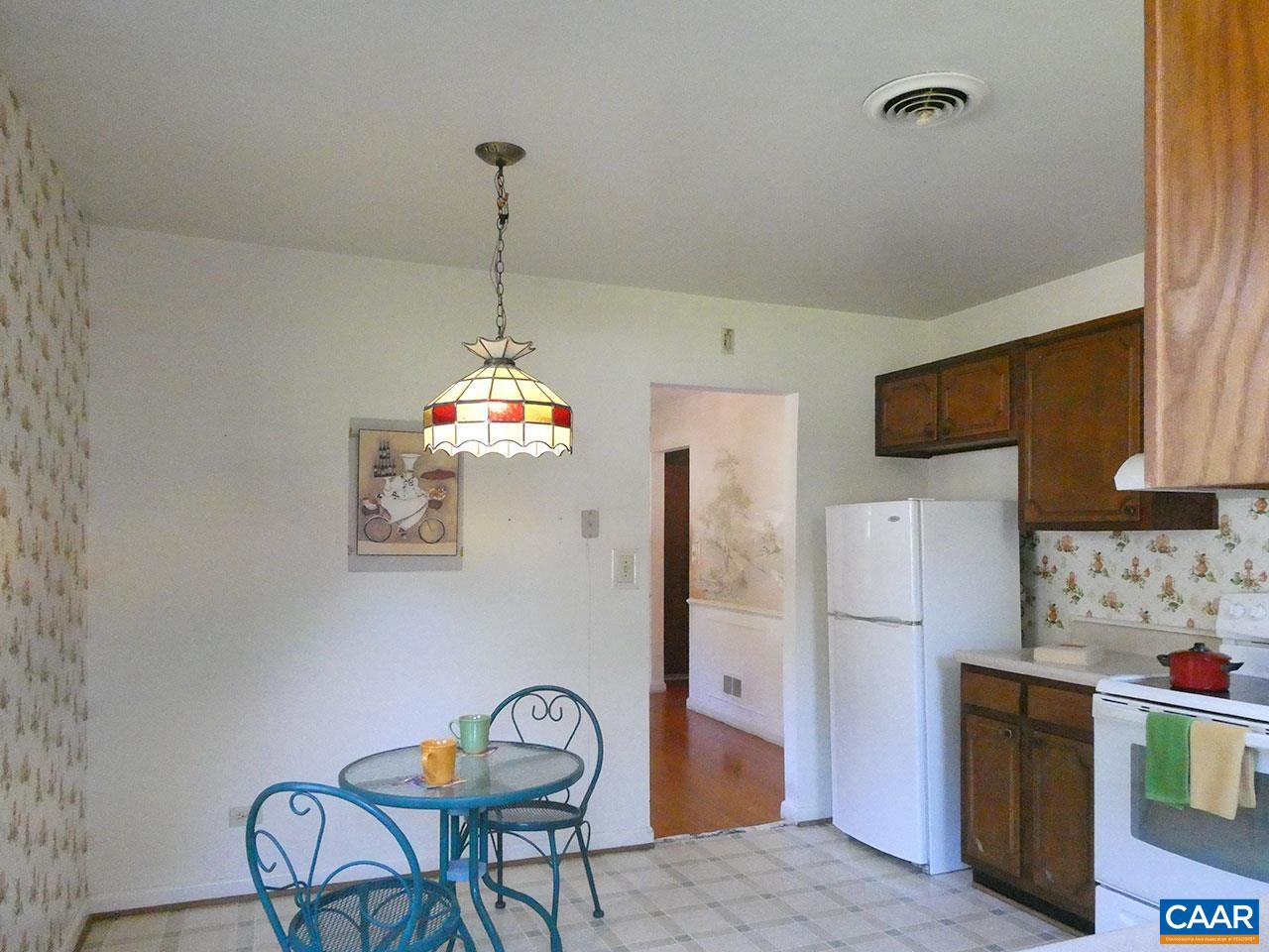 106 Elkhorn Road Charlottesville, VA 22903 - Photo 10 of 27 a kitchen with refrigerator a table and chairs