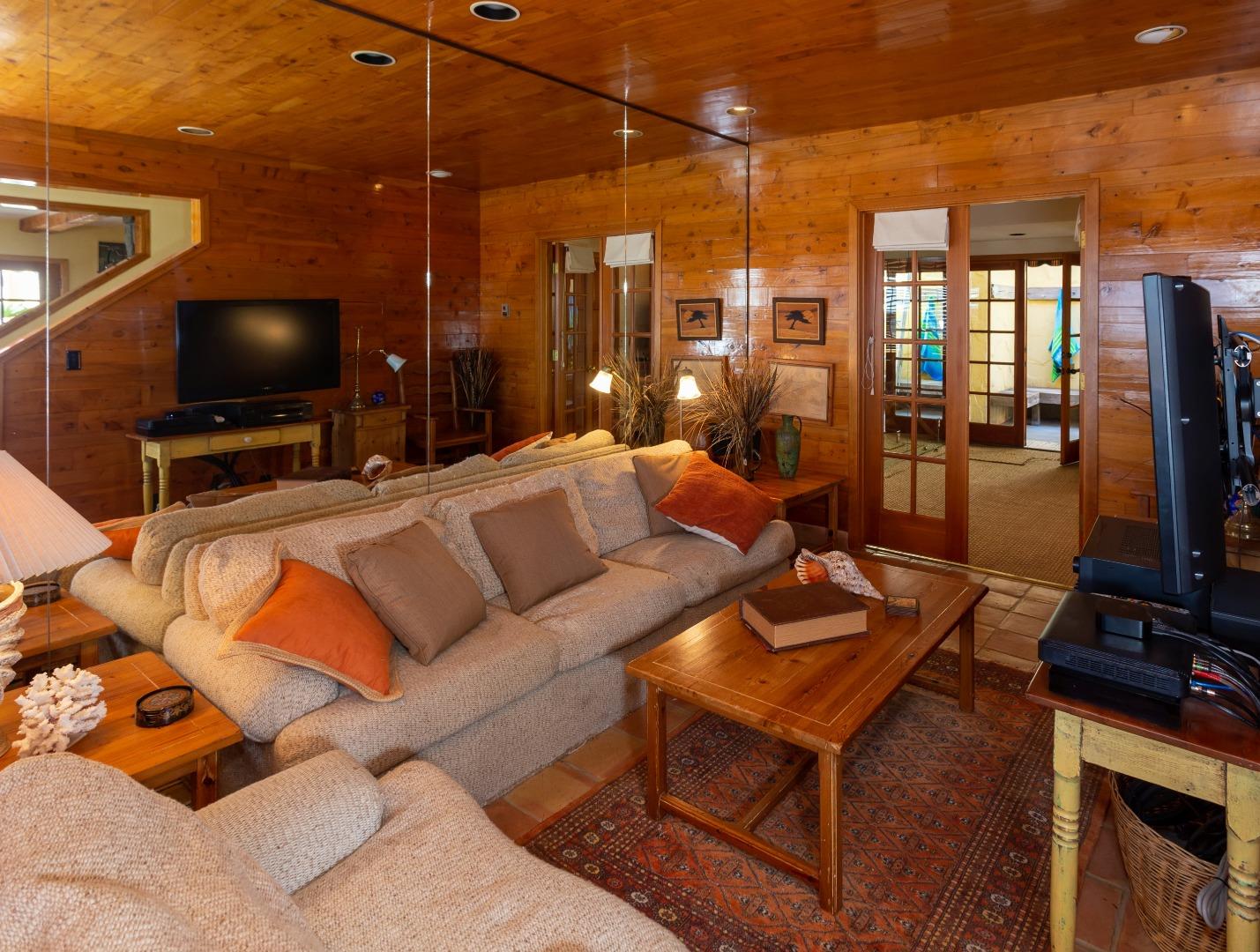 343 Beach Drive Aptos, CA 95003 - Photo 12 of 34 a view of a livingroom with furniture and a flat screen tv