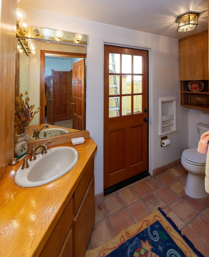 343 Beach Drive Aptos, CA 95003 - Photo 14 of 34 a bathroom with a sink double vanity and a toilet
