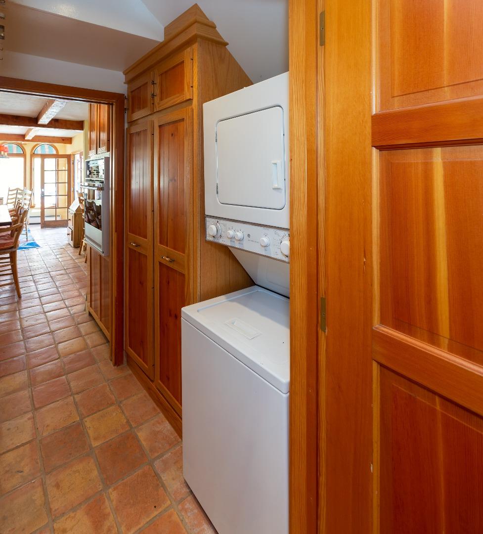 343 Beach Drive Aptos, CA 95003 - Photo 15 of 34 a hallway with a washer and dryer