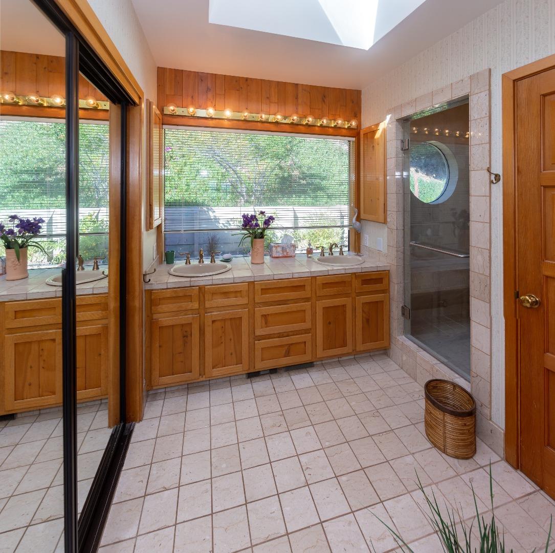 343 Beach Drive Aptos, CA 95003 - Photo 17 of 34 a room with a large window and a table chair