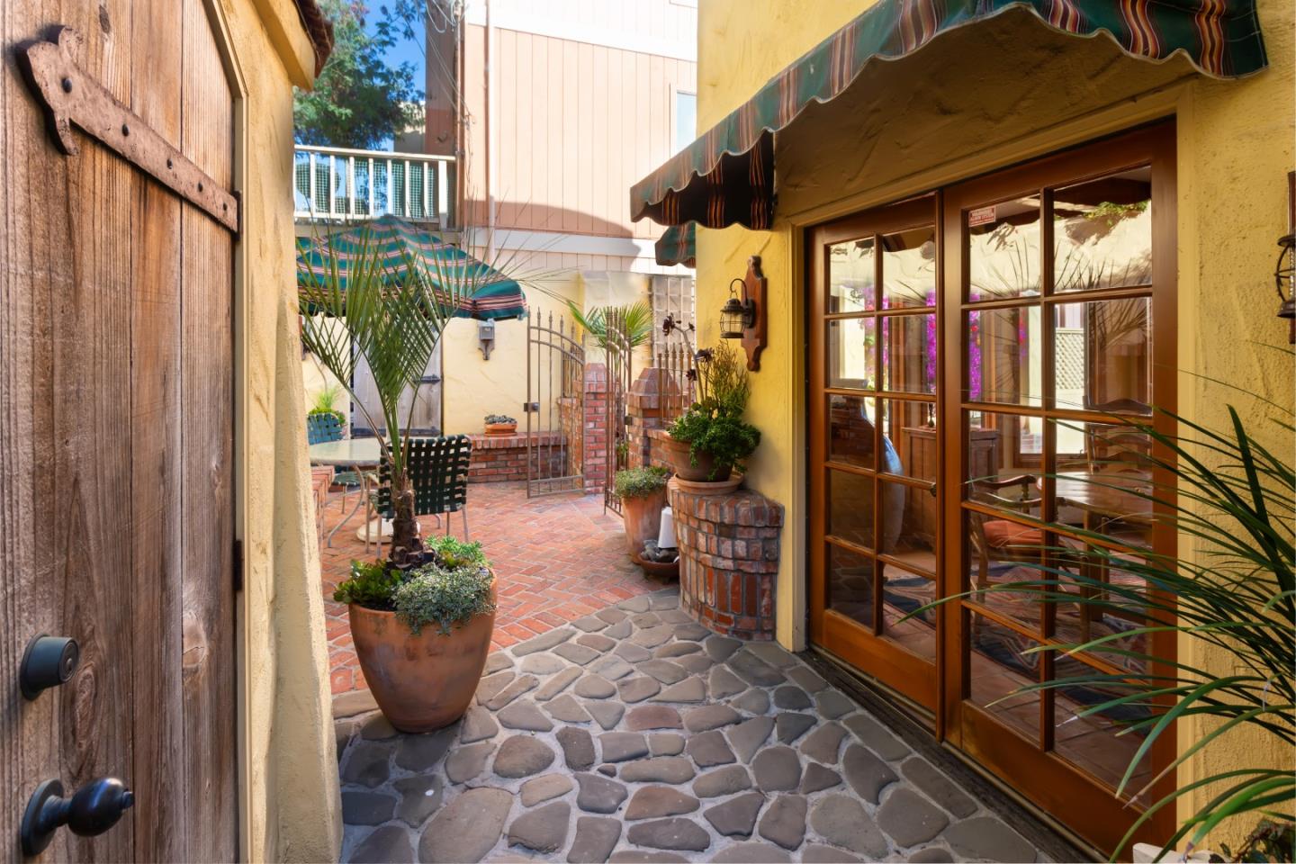 343 Beach Drive Aptos, CA 95003 - Photo 27 of 34 a view of a patio with couches and potted plants