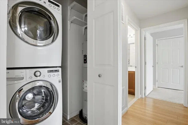 a view of a hallway with washer and dryer
