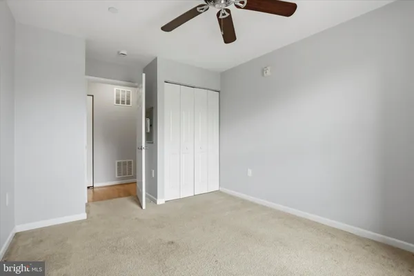 a view of a livingroom with a ceiling fan