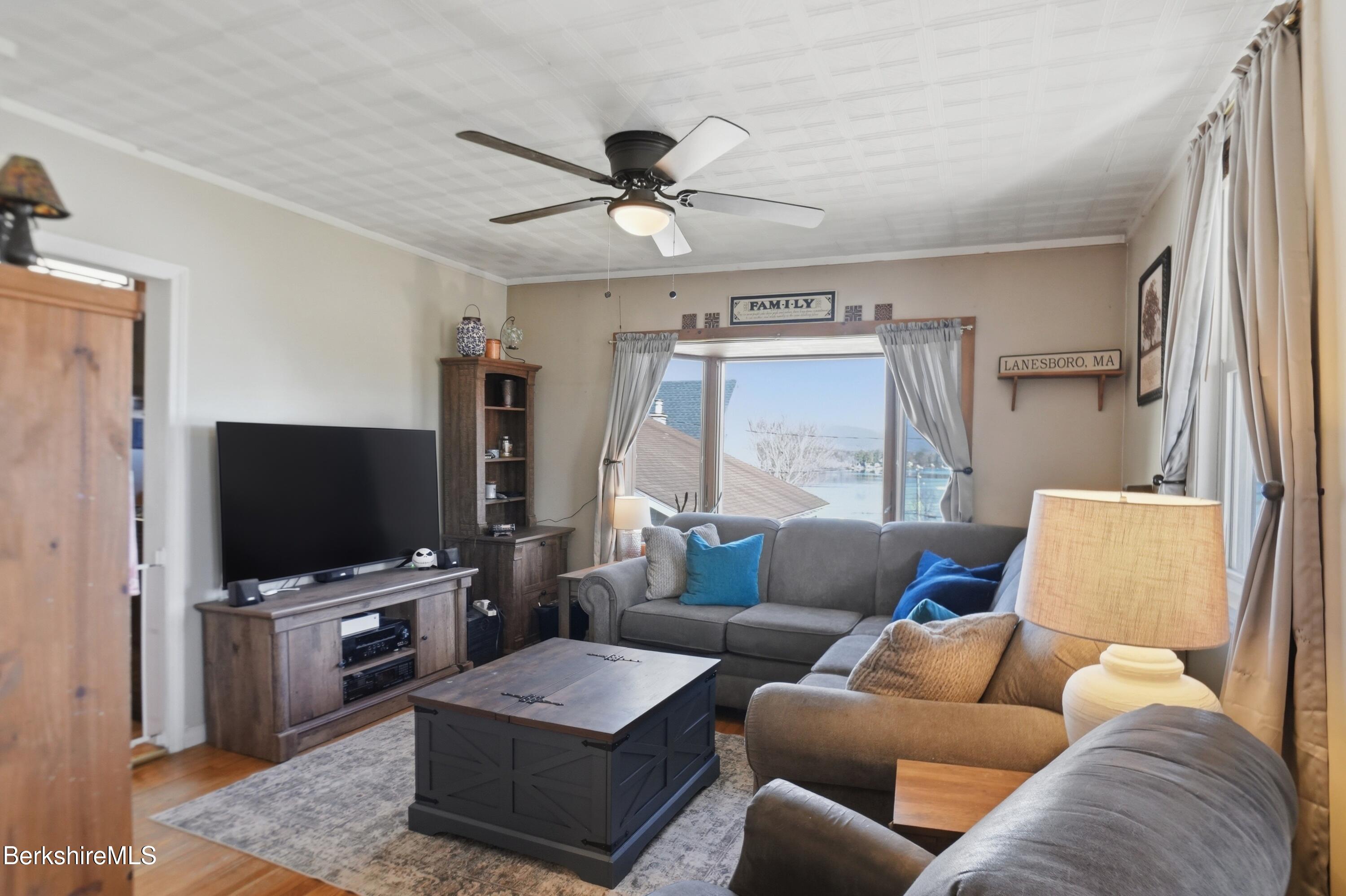 22 Broadway Street Pittsfield, MA 01201 - Photo 36 of 84 a living room with furniture and a flat screen tv