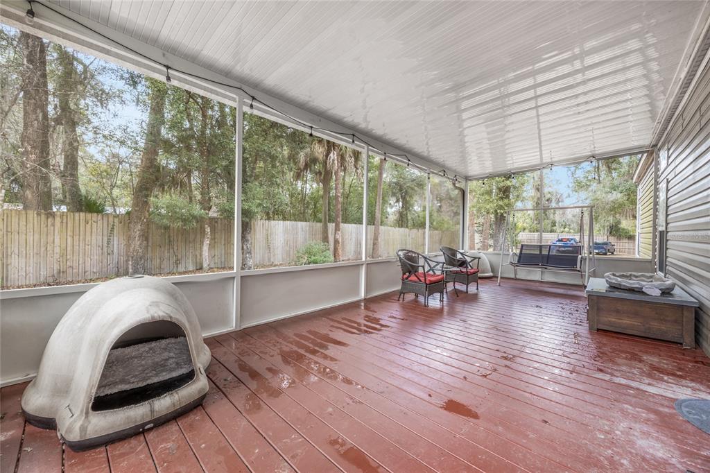 1085 State Rte 100 Florahome, FL 32140 - Photo 38 of 52 a living room filled with furniture and a large window