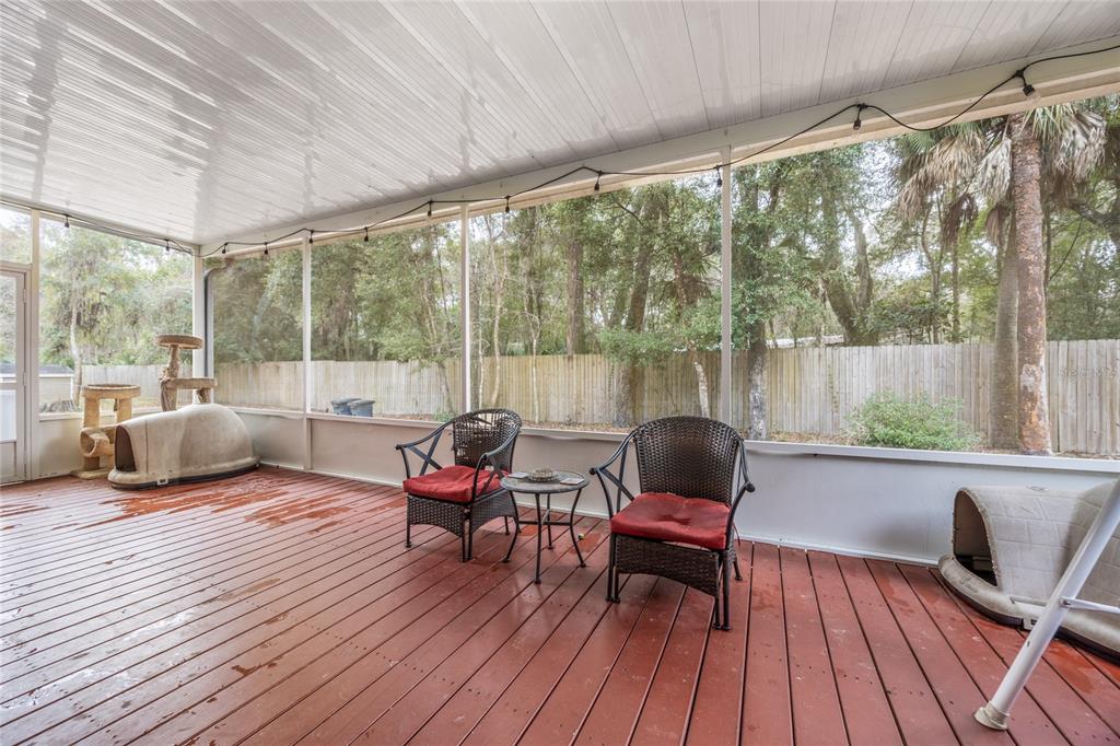 1085 State Rte 100 Florahome, FL 32140 - Photo 39 of 52 a living room filled with furniture and a wooden floor