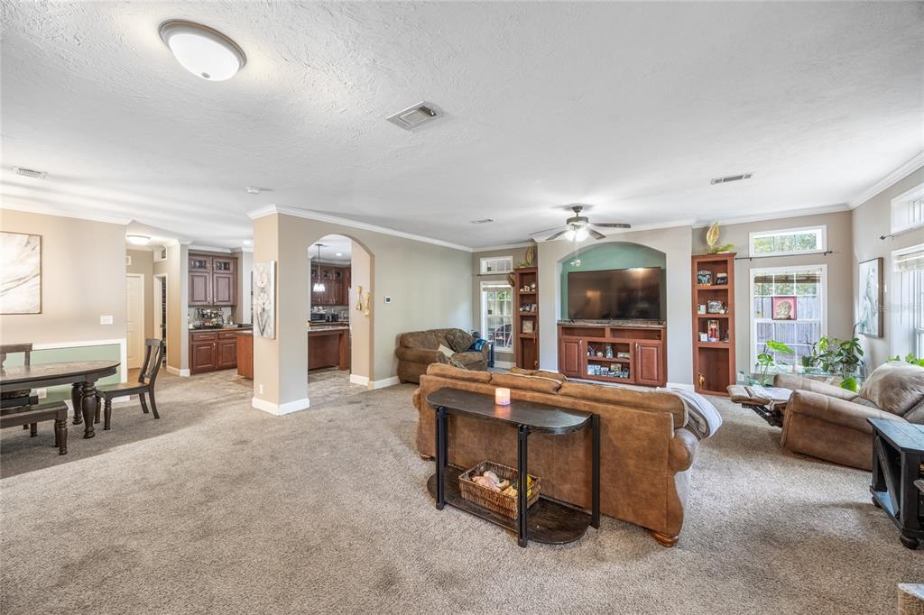 1085 State Rte 100 Florahome, FL 32140 - Photo 5 of 52 a living room with furniture and a dining table with kitchen view