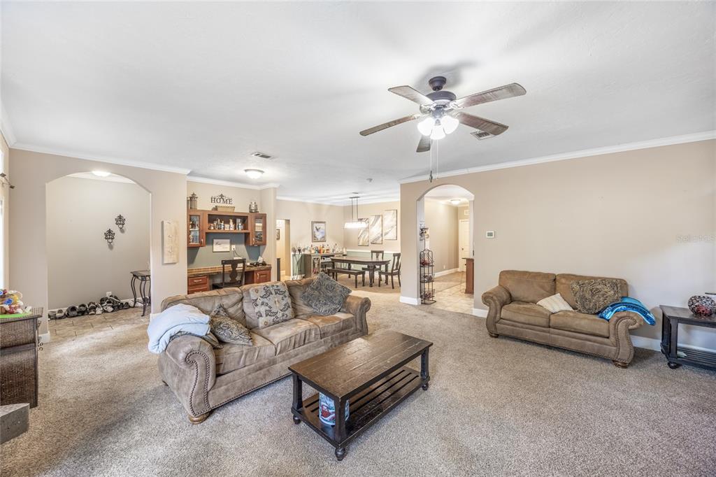 1085 State Rte 100 Florahome, FL 32140 - Photo 7 of 52 a living room with furniture and a chandelier